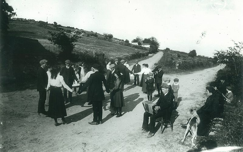 phot of a group of people dancing in Co. Cork, 100 years ago