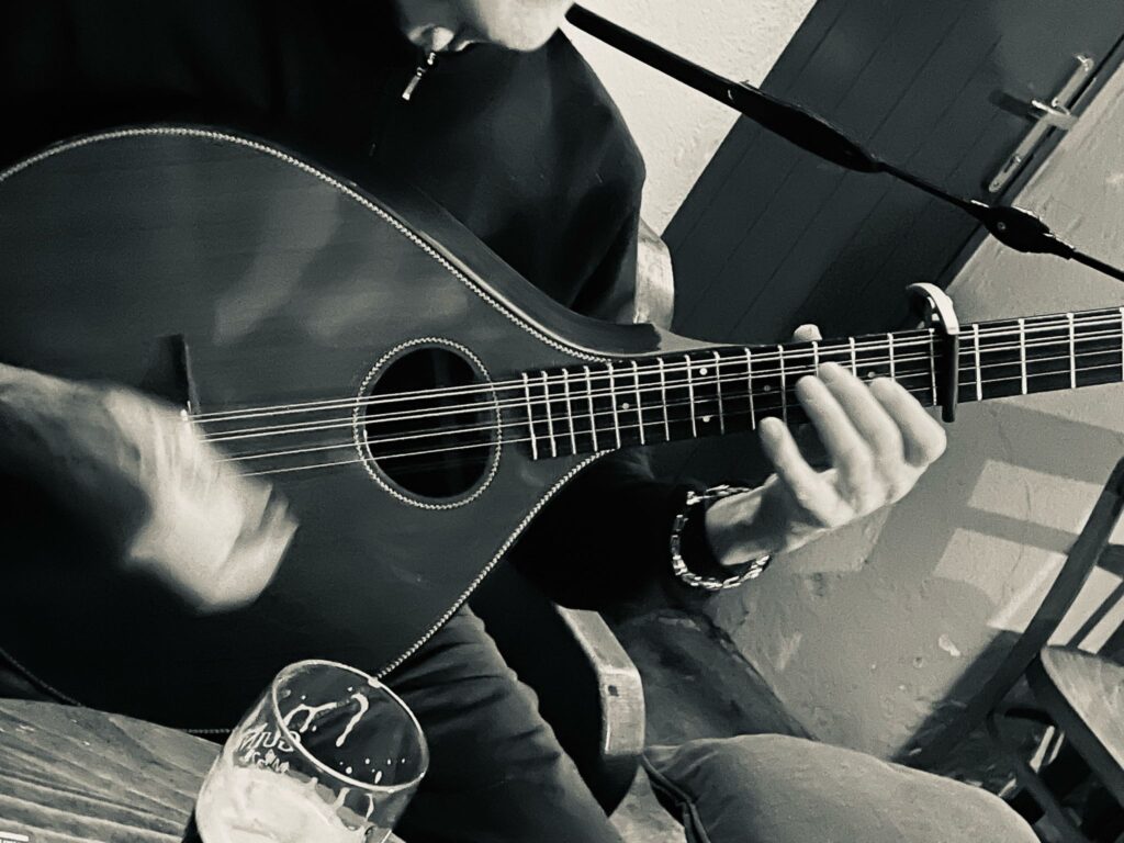 Close up of Rick playing cittern