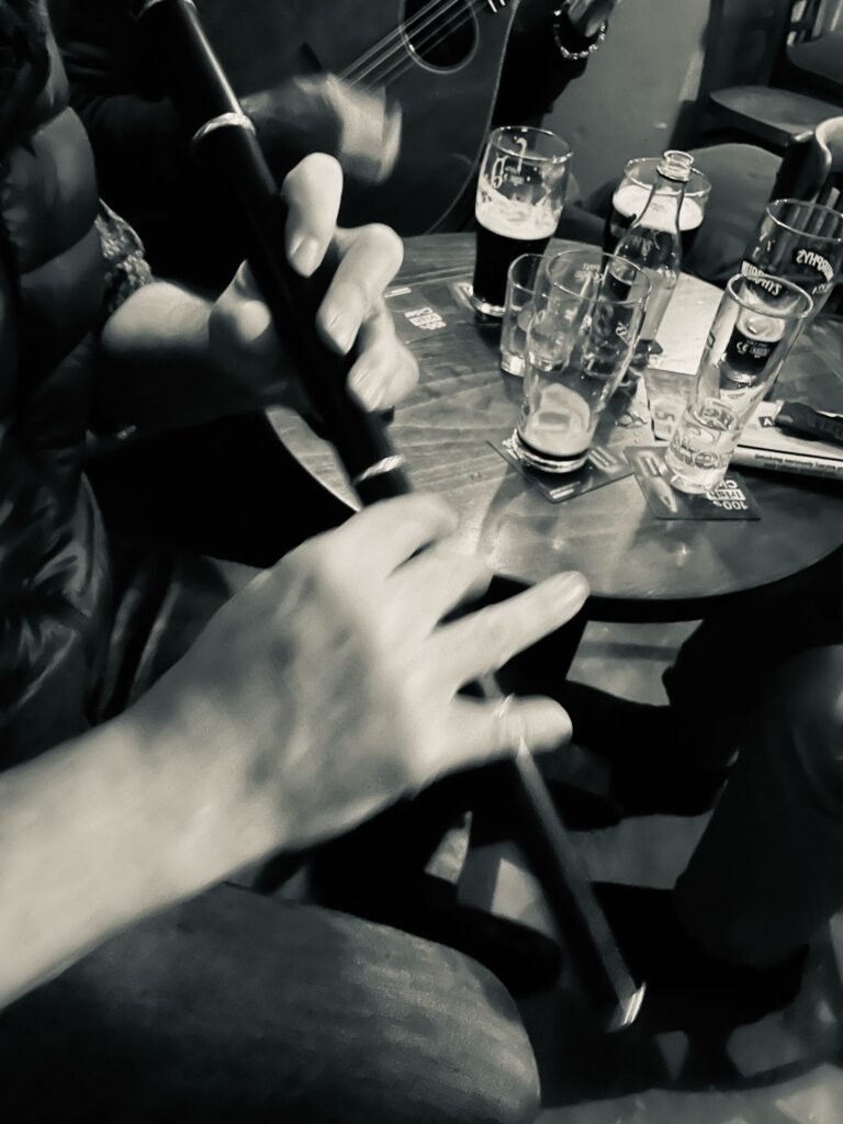 Close up of James playing flute