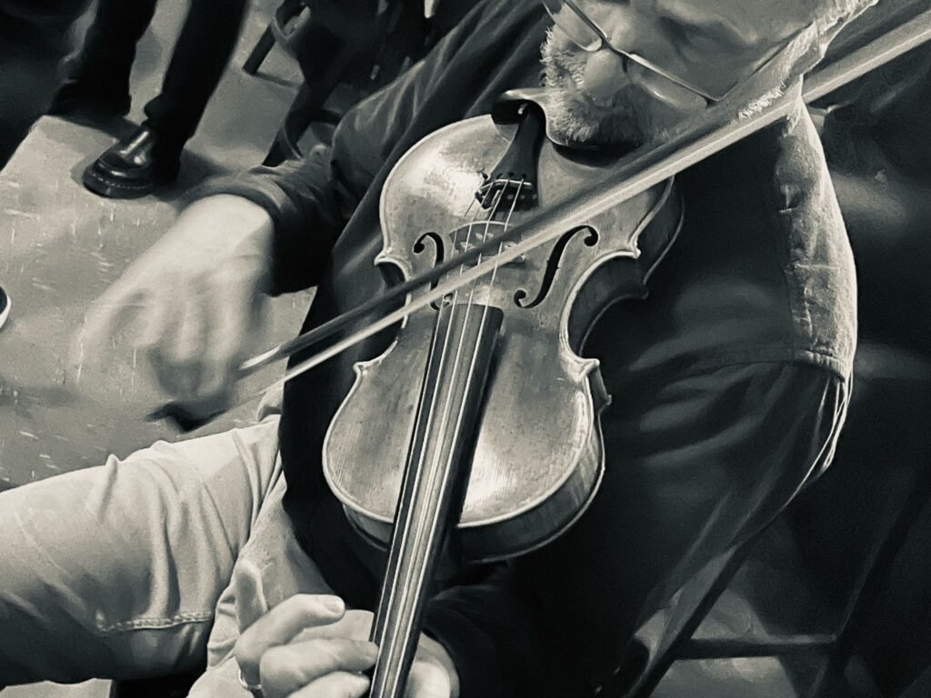 Close-up of Morgan playing fiddle